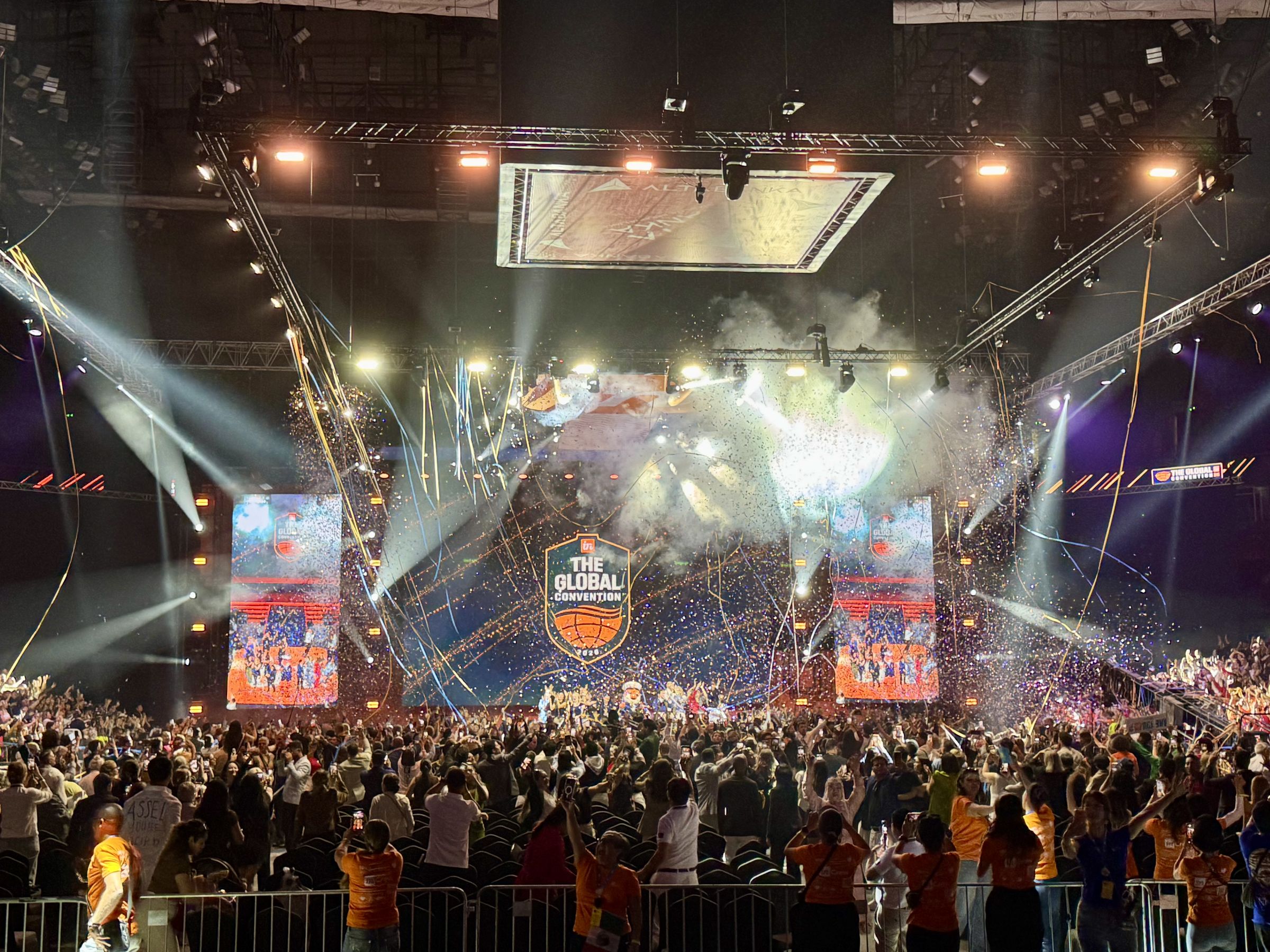 inCruises Global Convention — Belgrade Arena stage under confetti and lighting rig