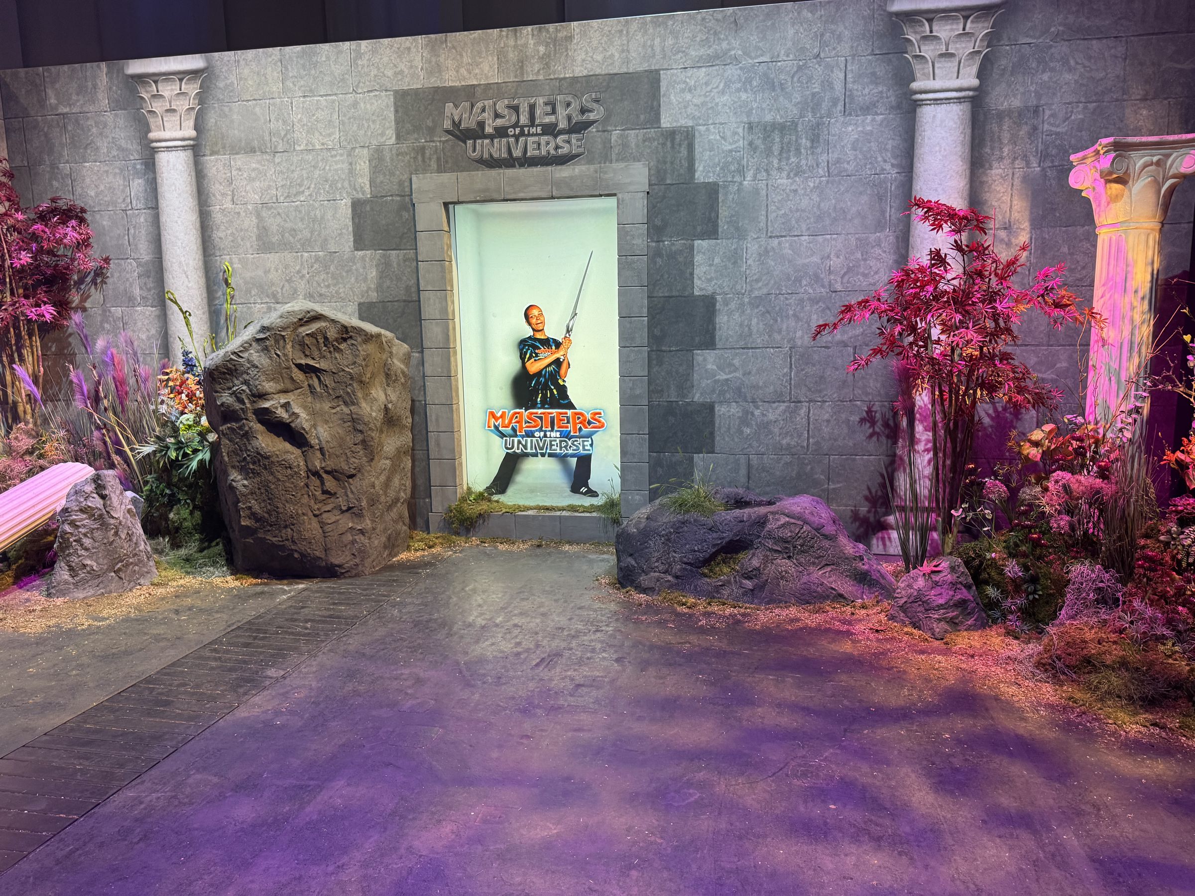 Masters of the Universe creator activation — castle-wall scenic set with columns, rockwork and a creator photo portal, Berlin