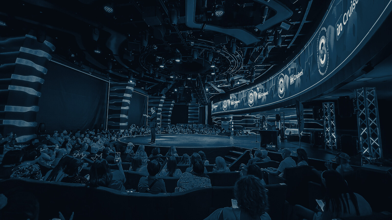 Packed house under a full stage-lighting rig at a Towerhouse production